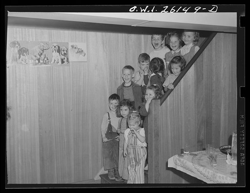Untitled photo, possibly related to: Washington, D.C. A day nursery for pre-school children of mothers engaged in war work, operated under the supervision of the District of Columbia Health Department by Mrs. Leroy Bonbrest, at her home at 1144 Branch Avenue, S.E. Children coming in to lunch