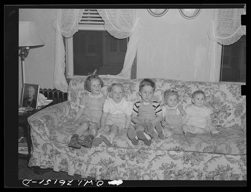 Washington, D.C. A day nursery for pre-school children of mothers engaged in war work, operated under the supervision of the District of Columbia Health Department by Mrs. Leroy Bonbrest, at her home at 1144 Branch Avenue, S.E. Some of the nursery children listening to the teacher