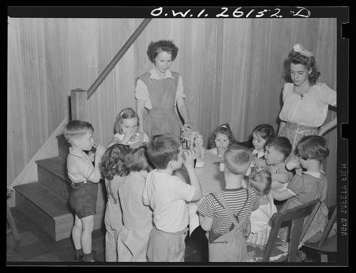 Washington, D.C. A day nursery for pre-school children of mothers engaged in war work, operated under the supervision of the District of Columbia Health Department by Mrs. Leroy Bonbrest, at her home at 1144 Branch Avenue, S.E. Having milk and cookies