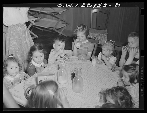 Washington, D.C. A day nursery for pre-school children of mothers engaged in war work, operated under the supervision of the District of Columbia Health Department by Mrs. Leroy Bonbrest, at her home at 1144 Branch Avenue, S.E. Having milk and cookies