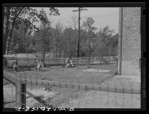 Untitled photo, possibly related to: Washington, D.C. A day nursery for pre-school children of mothers engaged in war work, operated under the supervision of the District of Columbia Health Department by Mrs. Leroy Bonbrest, at her home at 1144 Branch Avenue, S.E. Children playing in the yard