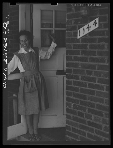 Washington, D.C. A day nursery for pre-school children of mothers engaged in war work, operated under the supervision of the District of Columbia Health Department by Mrs. Leroy Bonbrest at her home at 1144 Branch Avenue, S.E. Mrs. Bonbrest at her door to greet the children