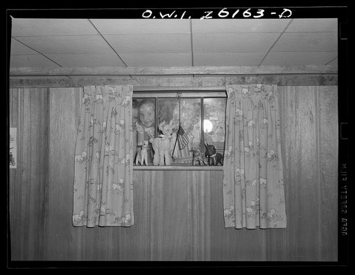 Washington, D.C. A day nursery for pre-school children of mothers engaged in war work, operated under the supervision of the District of Columbia Health Department by Mrs. Leroy Bonbrest at her home at 1144 Branch Avenue, S.E. Looking in the window