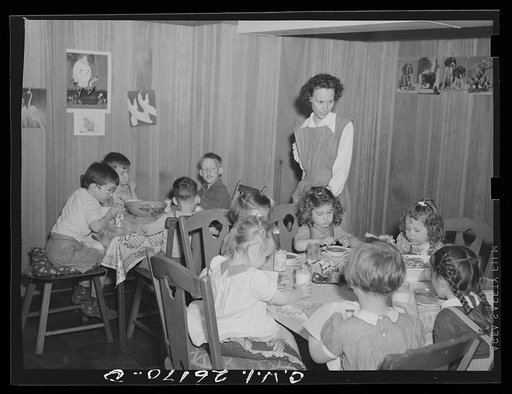 Washington, D.C. A day nursery for pre-school children of mothers engaged in war work, operated under the supervision of the District of Columbia Health Department by Mrs. Leroy Bonbrest, at her home at 1144 Branch Avenue, S.E. The children eating their lunch