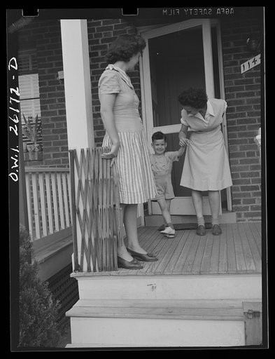 Untitled photo, possibly related to: Washington, D.C. A day nursery for pre-school children of mothers engaged in war work, operated under the supervision of the District of Columbia Health Department by Mrs. Leroy Bonbrest, at her home at 1144 Branch Avenue, S.E. A child bidding Mrs. Bonbrest good-