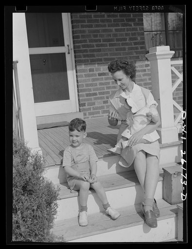 Washington, D.C. A day nursery for pre-school children of mothers engaged in war work, operated under the supervision of the District of Columbia Health Department by Mrs. Leroy Bonbrest, at her home at 1144 Branch Avenue, S.E. A child leaving the nursery