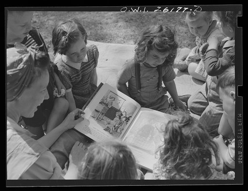 Washington, D.C. A day nursery for pre-school children of mothers engaged in war work, operated under the supervision of the District of Columbia Health Department by Mrs. Leroy Bonbrest, at her home at 1144 Branch Avenue, S.E. The children listening to a story