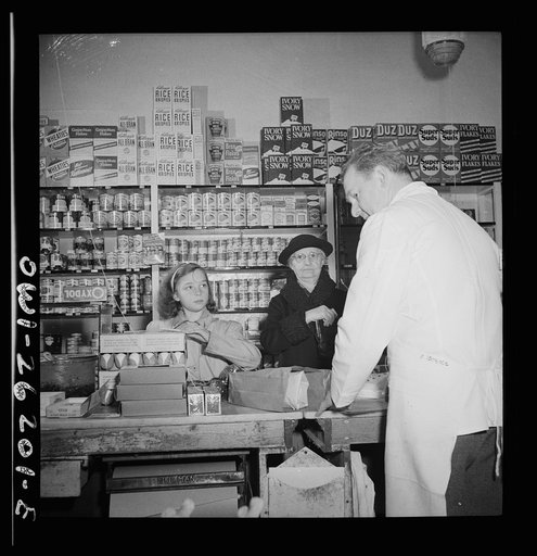 Buffalo, New York. Beverly Ann Grimm, eleven, doing the family shopping. She is making purchases from a list left that morning by her mother who is a crane operator at Pratt and Letchworth