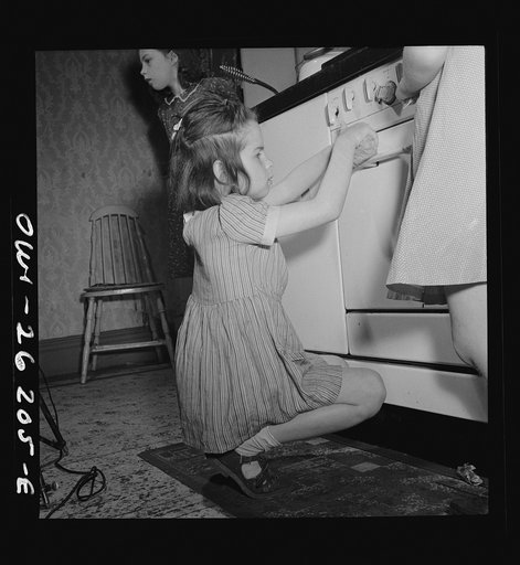 Buffalo, New York. The Grimm children doing the housework. The mother, a twenty-six year old widow, is a crane operator at Pratt and Letchworth