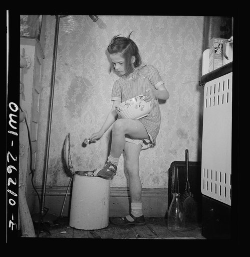Buffalo, New York. Mary Grimm, eight, doing the housework.  Her mother, a twenty-six year old widow, is a crane operator at Pratt and Letchworth