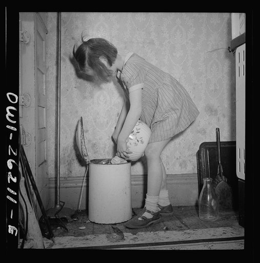 Buffalo, New York. Mary Grimm, eight, doing the housework.  Her mother, a twenty-six year old widow, is a crane operator at Pratt and Letchworth