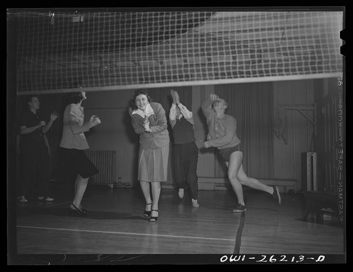 Untitled photo, possibly related to: Buffalo, New York. Playing volleyball at Young Women's Christian Association (YWCA) coeducational recreation program for third shift and swing shift workers from 9 a.m. to 1 and midnight to 5 a.m.; includes sports, singing and dancing