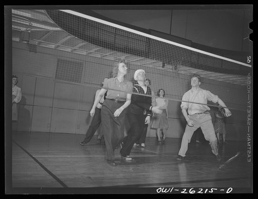 Untitled photo, possibly related to: Buffalo, New York. Playing volleyball at Young Women's Christian Association (YWCA) coeducational recreation program for third shift and swing shift workers from 9 a.m. to 1 and midnight to 5 a.m.; includes sports, singing and dancing