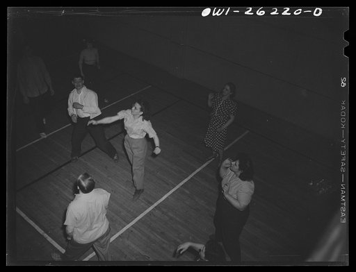 Untitled photo, possibly related to: Buffalo, New York. Playing volleyball at Young Women's Christian Association (YWCA) coeducational recreation program for third shift and swing shift workers from 9 a.m. to 1 and midnight to 5 a.m.; includes sports, singing and dancing