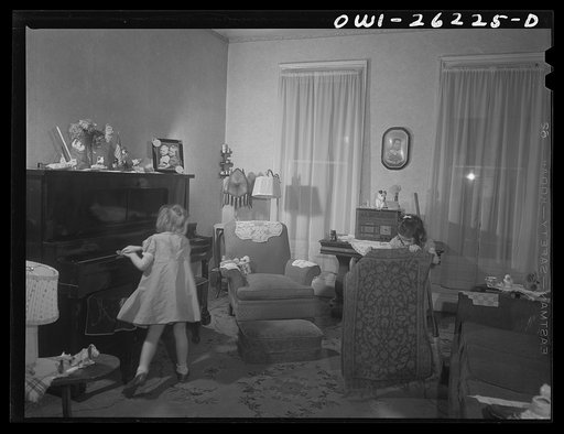 Untitled photo, possibly related to: Buffalo, New York. Patsy Grimm, age six, dusting and Mary Grimm, eight, sweeping in the front room. Their mother, a twenty-six year old widow, is a crane operator at Pratt and Letchworth