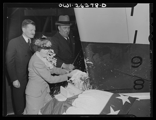 Bethlehem-Fairfield shipyards, Baltimore, Maryland. Sponsor smashing the champagne bottle to christen the ship