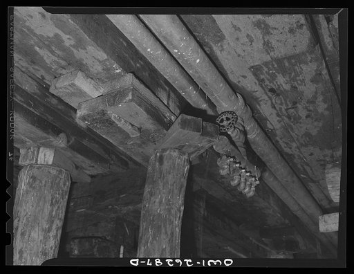 Bethlehem-Fairfield shipyards, Baltimore, Maryland. Preparations for launching a ship. Wedges and pipe connection underneath the ship