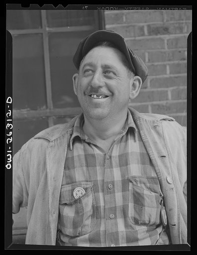 Bethlehem-Fairfield shipyards, Baltimore, Maryland. Shipyard worker with gold teeth
