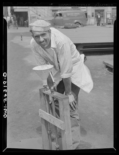 Bethlehem-Fairfield shipyards, Baltimore, Maryland. A shipyard worker taking a drink of water