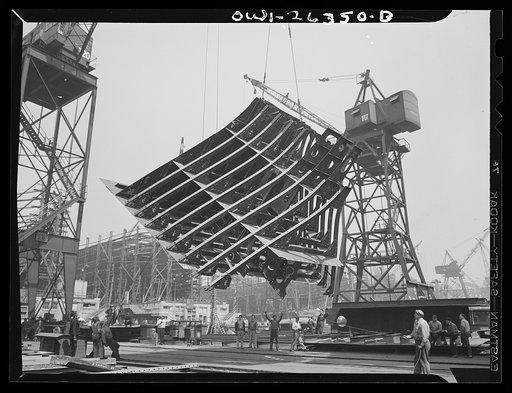 Bethlehem-Fairfield shipyards, Baltimore, Maryland. Lifting a thirty-ton section from the fabricating table