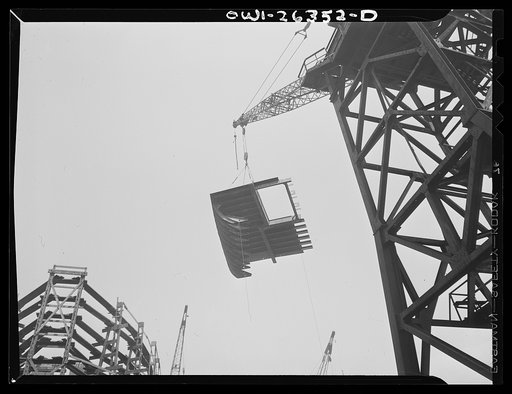 Bethlehem-Fairfield shipyards, Baltimore, Maryland. Lifting a ship section