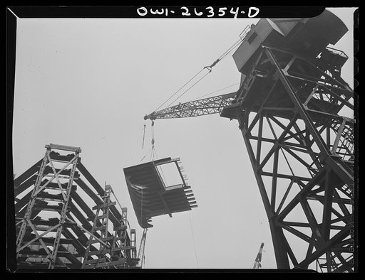 Bethlehem-Fairfield shipyards, Baltimore, Maryland. Lifting a ship section