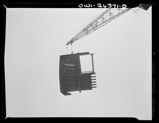 Bethlehem-Fairfield shipyards, Baltimore, Maryland. Lifting a ship section