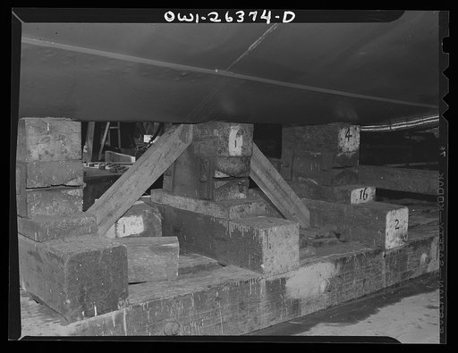 Bethlehem-Fairfield shipyards, Baltimore, Maryland. Preparations for launching a ship. Keel blocks underneath the ship
