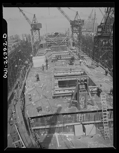 Bethlehem-Fairfield shipyards, Baltimore, Maryland. Ship under construction, half-completed