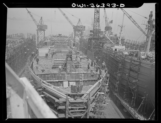 Bethlehem-Fairfield shipyards, Baltimore, Maryland. Ship under construction, half-completed
