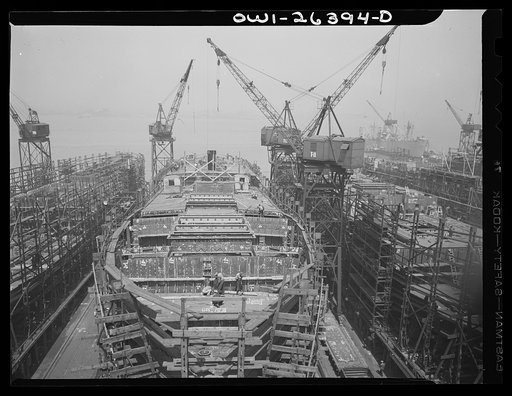 Bethlehem-Fairfield shipyards, Baltimore, Maryland. Ship under construction, half-completed