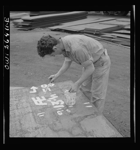 Bethlehem-Fairfield shipyards, Baltimore, Maryland. Painting identification numbers on the steel plates