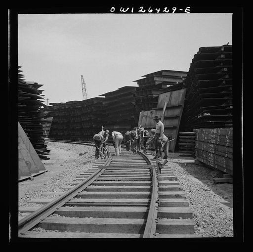Bethlehem-Fairfield shipyards, Baltimore, Maryland. Preparing the railroad tracks in the shipyards