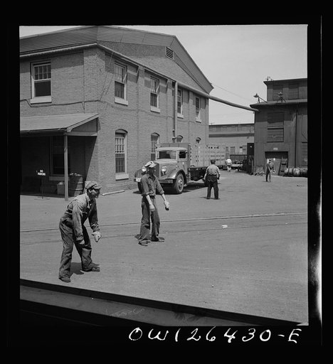 Bethlehem-Fairfield shipyards, Baltimore, Maryland. Playing a game of catch