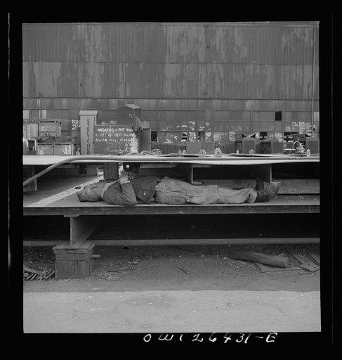 Bethlehem-Fairfield shipyards, Baltimore, Maryland. Worker resting during lunch hour