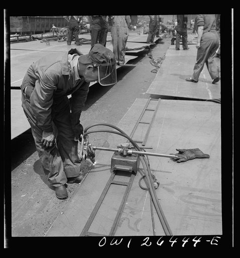 Bethlehem-Fairfield shipyards, Baltimore, Maryland. Using burning machine which runs on a track