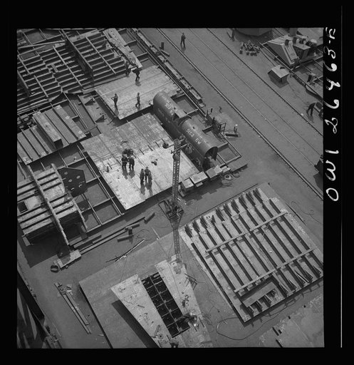 Bethlehem-Fairfield shipyards, Baltimore, Maryland. Transferring a completed section to the ship