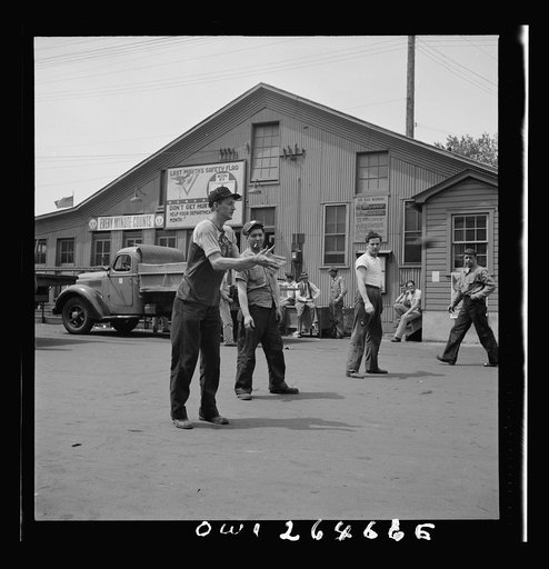 Bethlehem-Fairfield shipyards, Baltimore, Maryland. Playing a game of catch during lunch hour