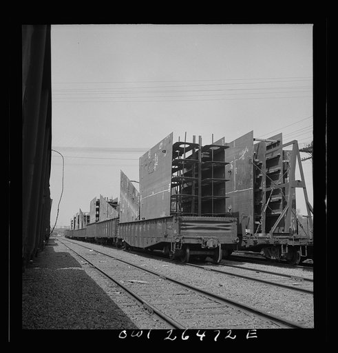 Bethlehem-Fairfield shipyards, Baltimore, Maryland. Steel section on a freight car
