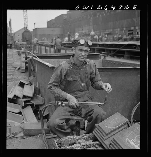 Bethlehem-Fairfield shipyards, Baltimore, Maryland. Burner with workmen
