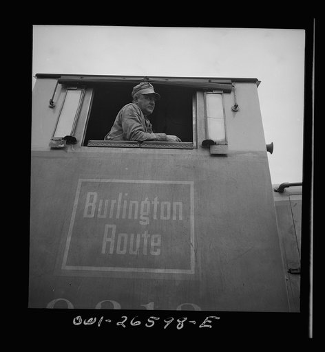 Cicero, Illinois. Engineer in the cab of a diesel switch engine at the Clyde yard of the Chicago, Burlington and Quincy Railroad