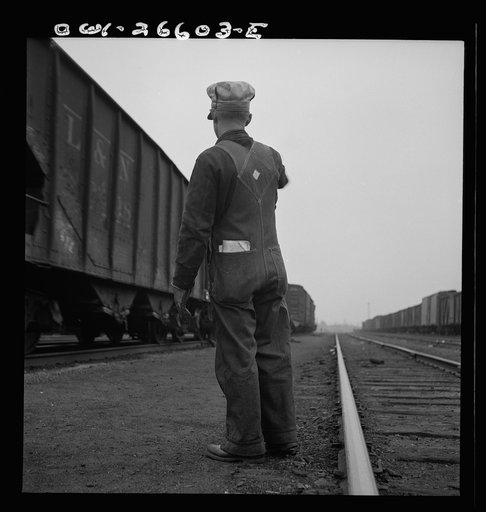 Untitled photo, possibly related to: Switching a train with a diesel switch engine on the Chicago and Rock Island Railroad