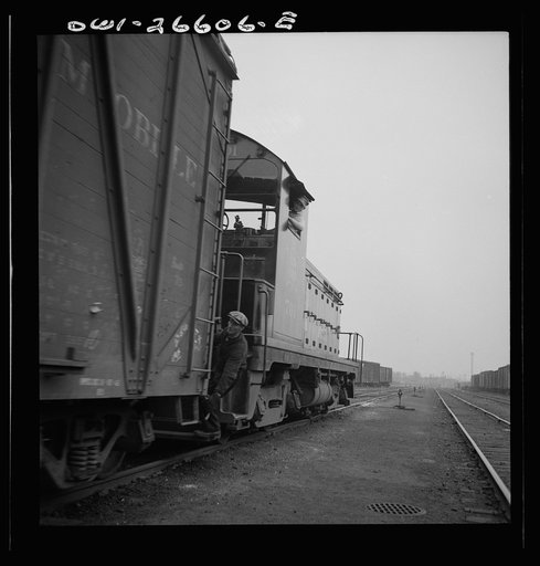 Blue Island, Illinois. Switching a train with a diesel switch engine on the Chicago and Rock Island Railroad