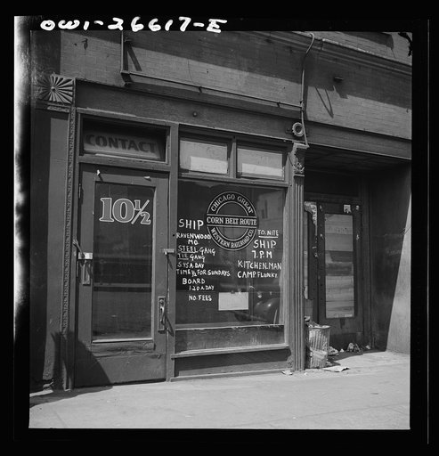 Chicago, Illinois. Railroad help wanted signs in windows of an employment agency near the Union Station