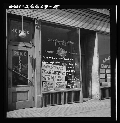 Chicago, Illinois. Railroad help wanted signs in windows of an employment agency near the Union Station