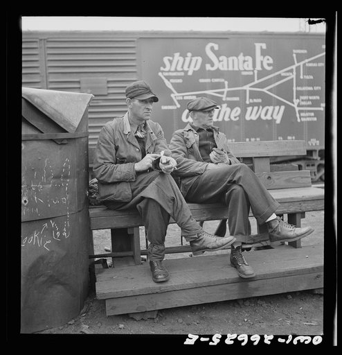 Untitled photo, possibly related to: Cicero, Illinois. Switchmen discussing their switch lists at the Clyde yard of the Chicago, Burlington and Quincy Railroad