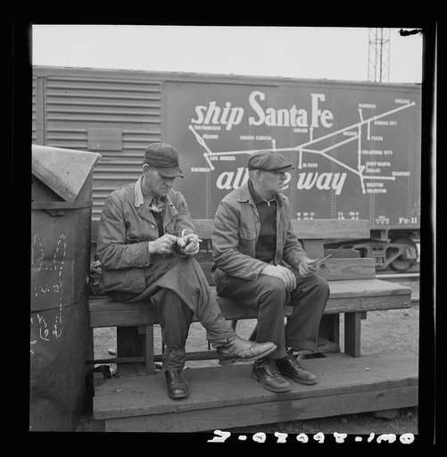 Untitled photo, possibly related to: Cicero, Illinois. Switchmen discussing their switch lists at the Clyde yard of the Chicago, Burlington and Quincy Railroad