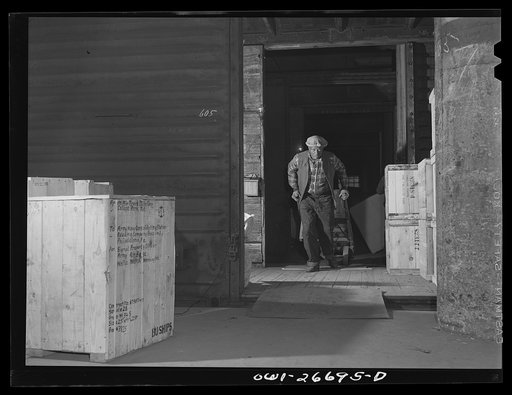 Chicago, Illinois. A freight handler at work at the United States Army consolidating station