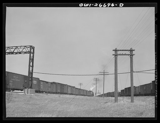 Untitled photo, possibly related to: Bensenville, Illinois. A redball west coast freight train leaving the Bensenville yard of the Chicago, Milwaukee, Saint Paul and Pacific Railroad