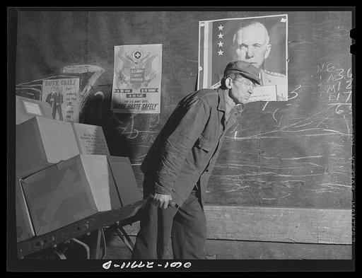 Chicago, Illinois. A freight handler at work at the United States Army consolidating station